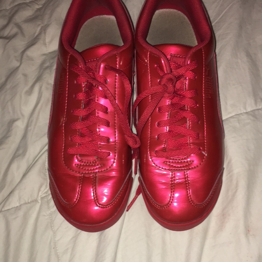 Shiny red pumas, size 6 mens//8 in womens